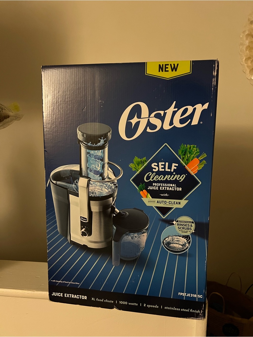 Oster Blue and Silver Self-Cleaning Juice Extractor